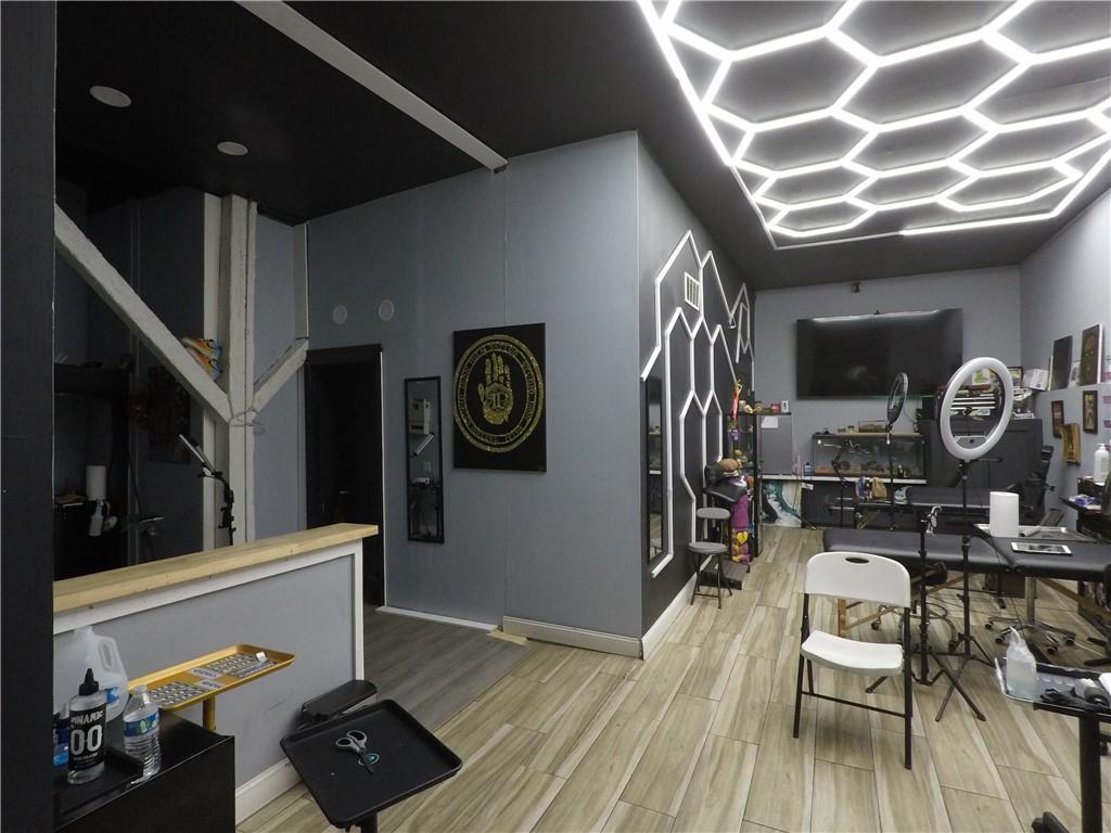 251 Trinity Avenue Southwest Atlanta, GA 30303 - Photo 23 of 32 a view of a hallway with wooden floor and staircase