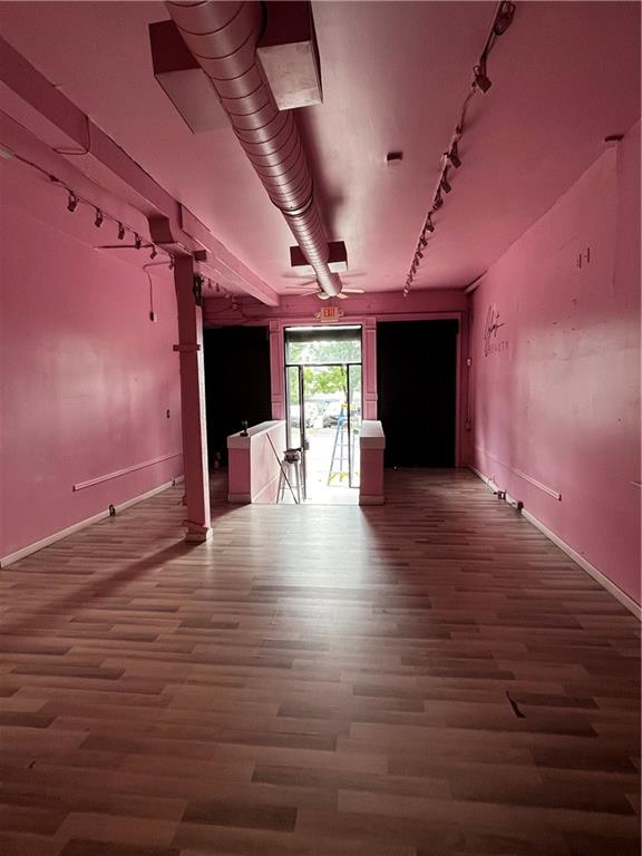 251 Trinity Avenue Southwest Atlanta, GA 30303 - Photo 32 of 32 a view of a hall with wooden floor