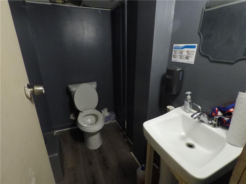 251 Trinity Avenue Southwest Atlanta, GA 30303 - Photo 8 of 32 a bathroom with a sink and a toilet