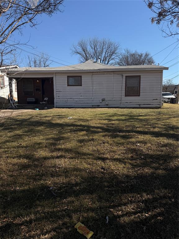 2819 Village Creek Road Fort Worth, TX 76105 - Photo 1 of 11 a front view of a house with a garden