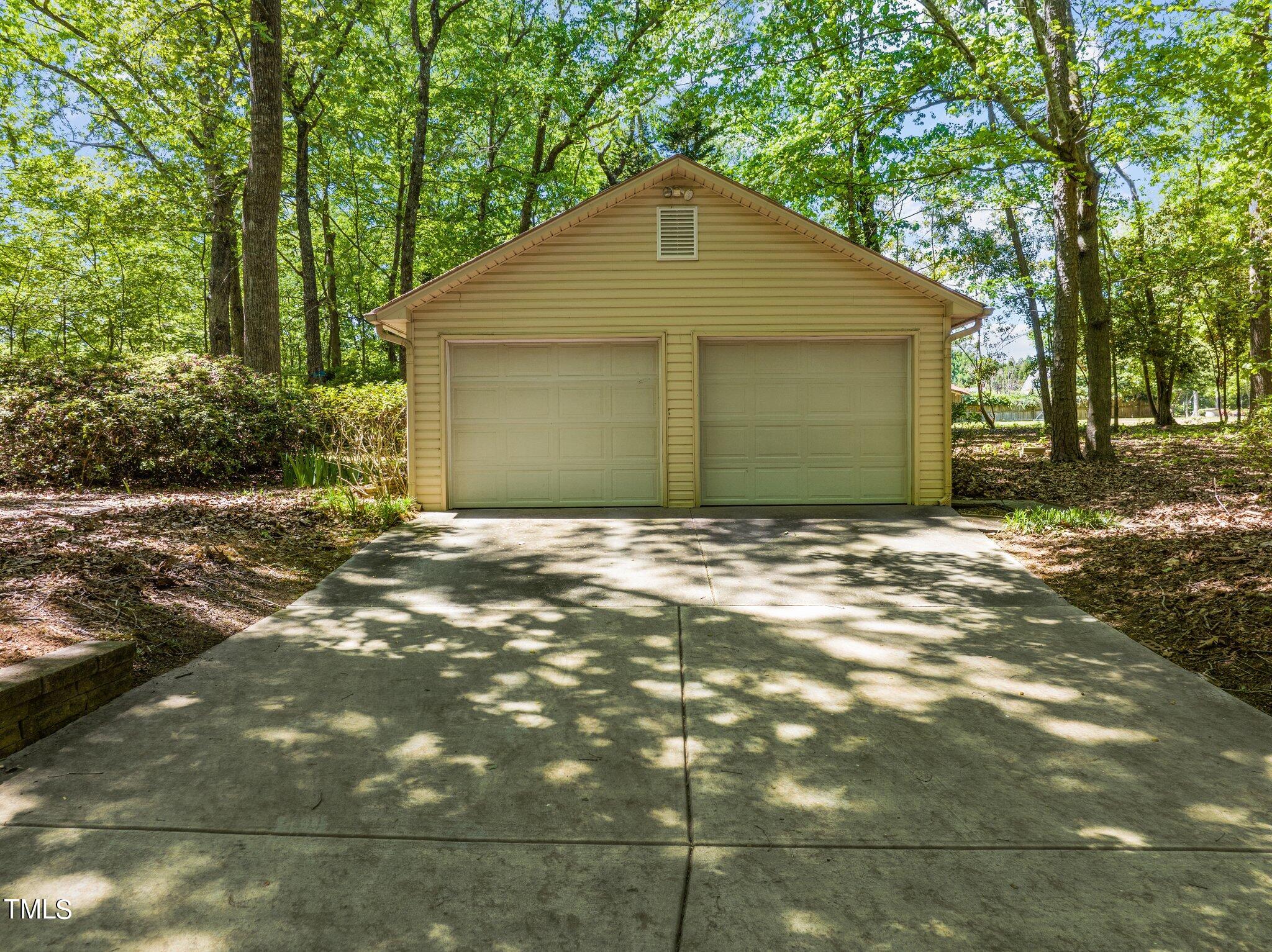 8413 Bournemouth Drive Raleigh, NC 27615 - Photo 14 of 94 a front view of a house with a yard