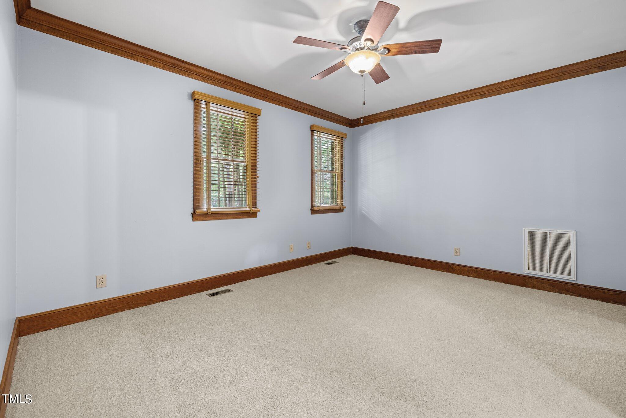 8413 Bournemouth Drive Raleigh, NC 27615 - Photo 40 of 94 wooden floor in an empty room with a window