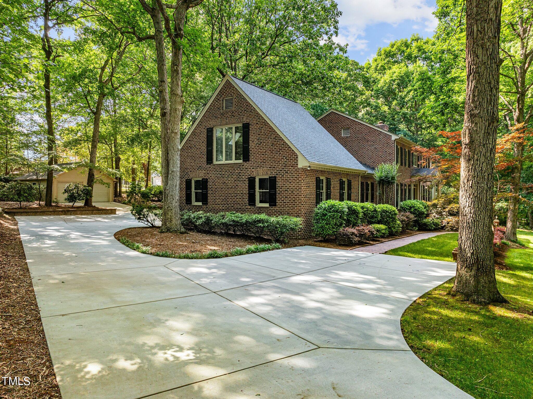 8413 Bournemouth Drive Raleigh, NC 27615 - Photo 6 of 94 a view of a house with yard and plants