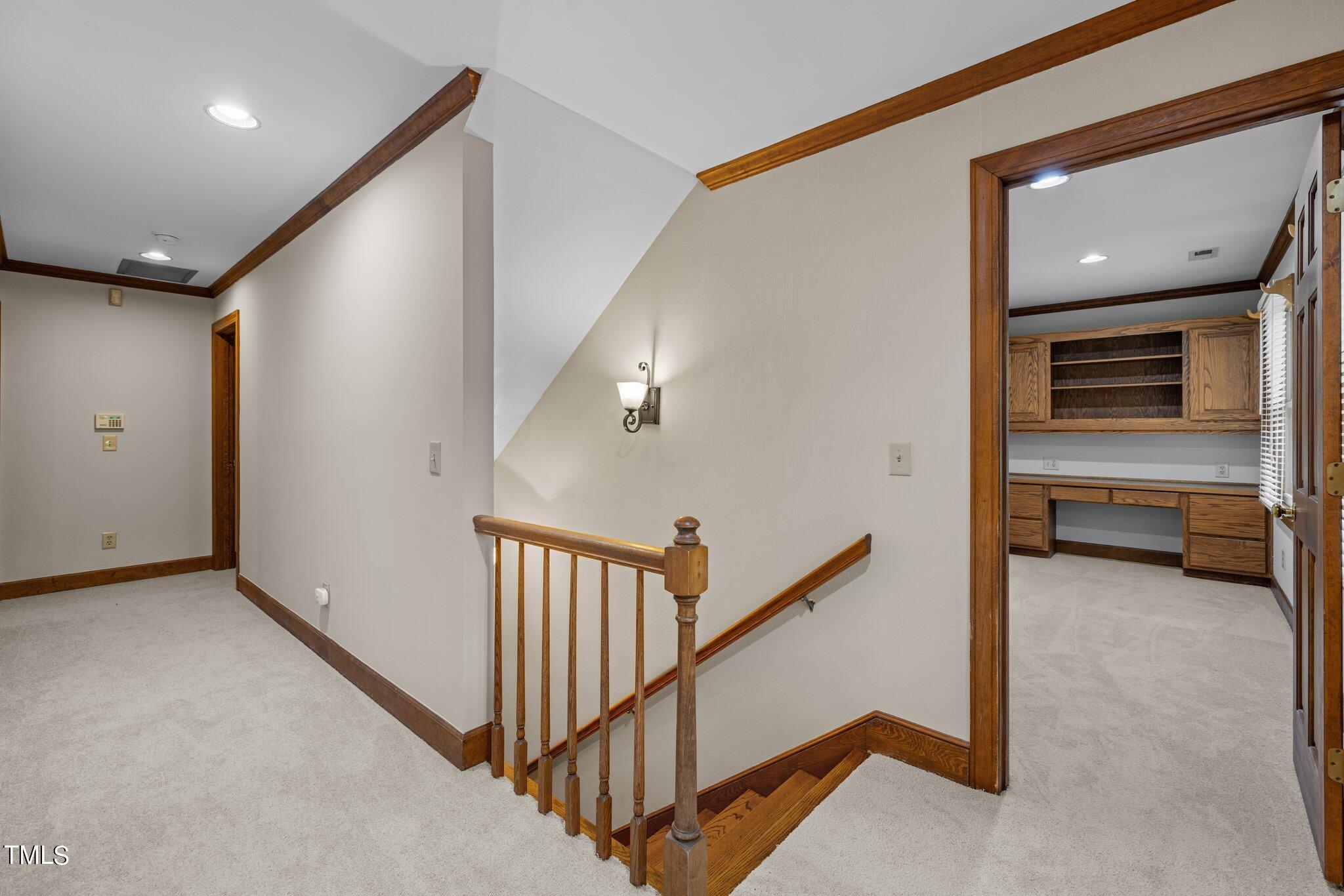 8413 Bournemouth Drive Raleigh, NC 27615 - Photo 64 of 94 a view of a hallway with stairs