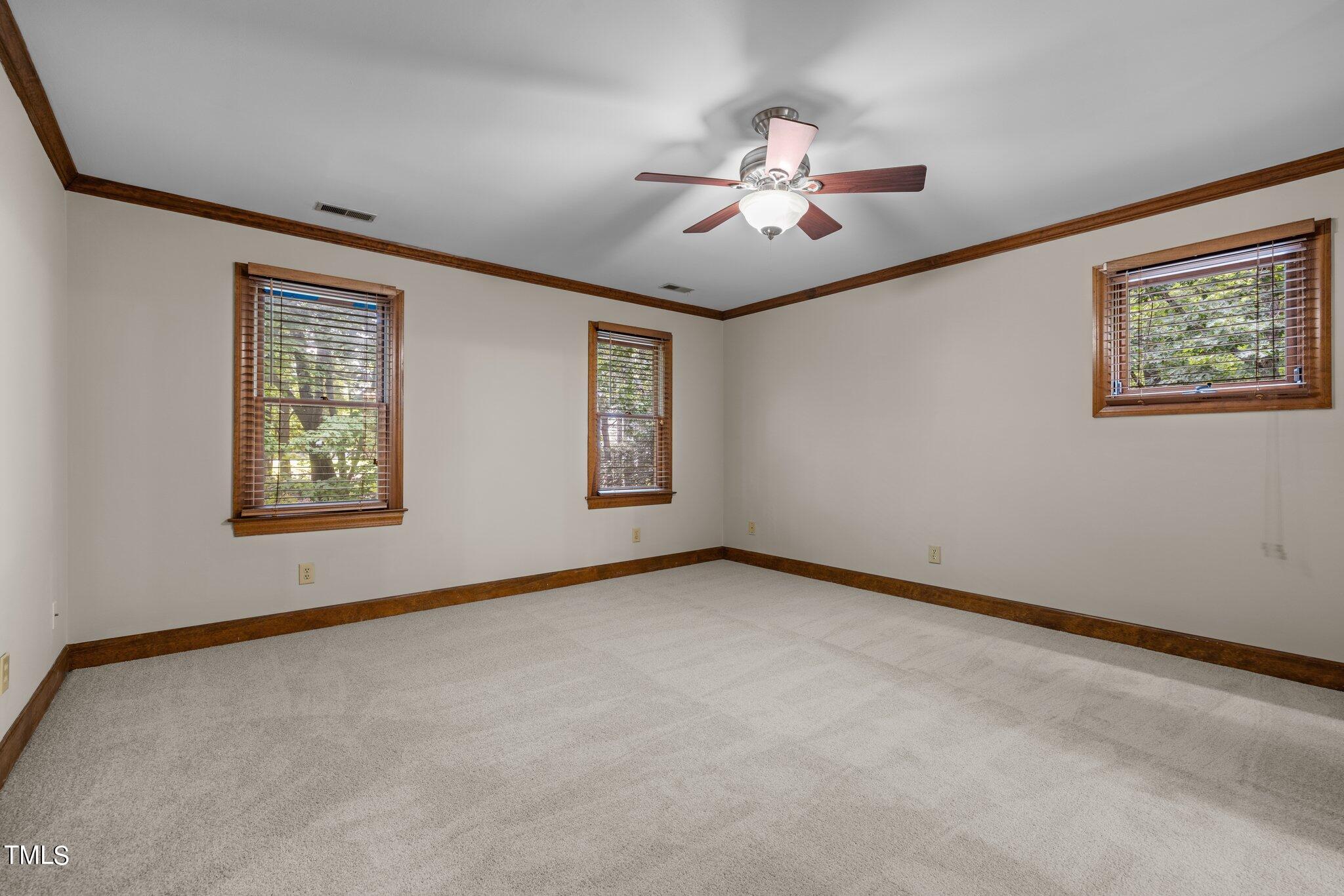 8413 Bournemouth Drive Raleigh, NC 27615 - Photo 73 of 94 a view of an empty room with window