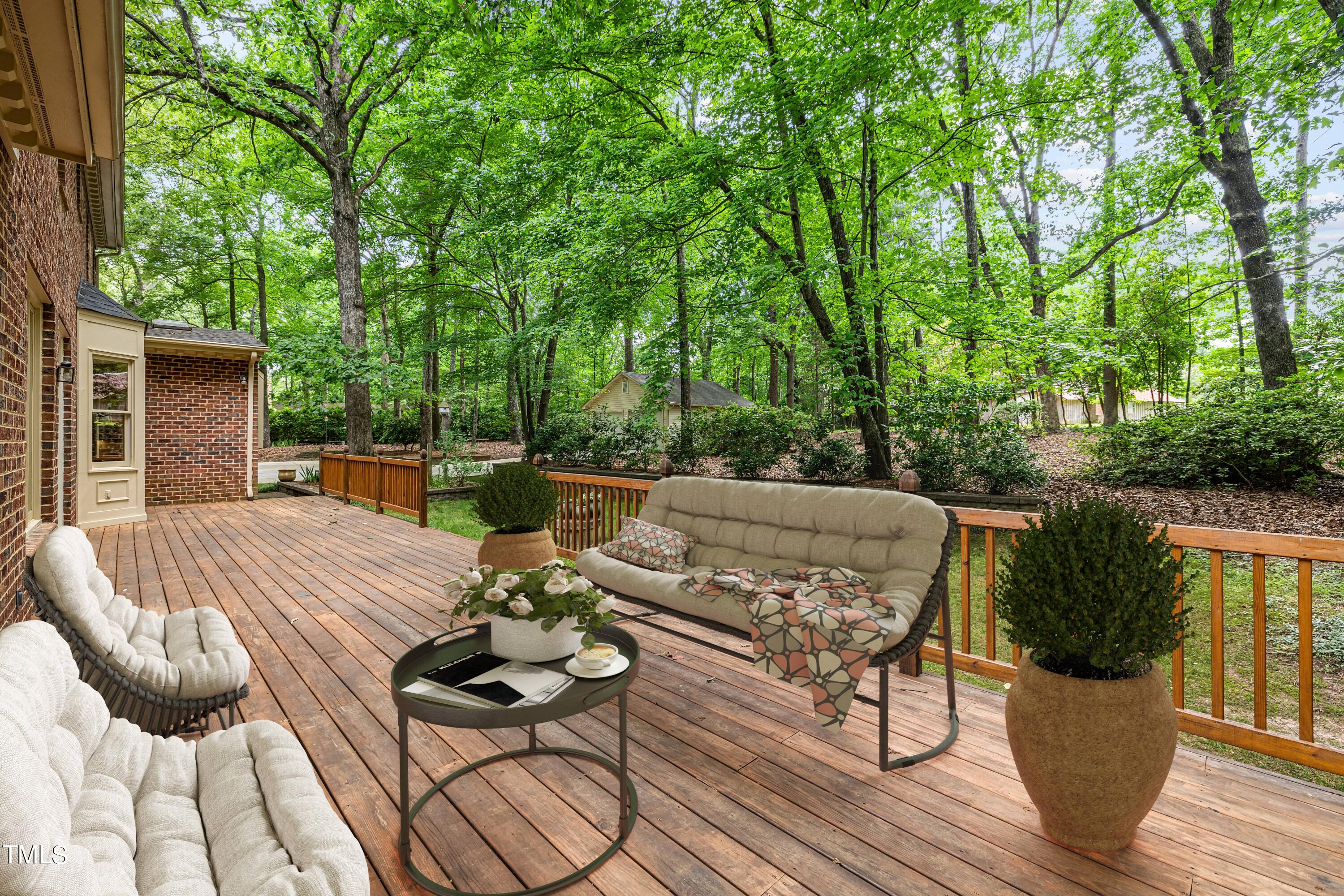 8413 Bournemouth Drive Raleigh, NC 27615 - Photo 80 of 94 a view of a patio with couches chairs and a potted plant