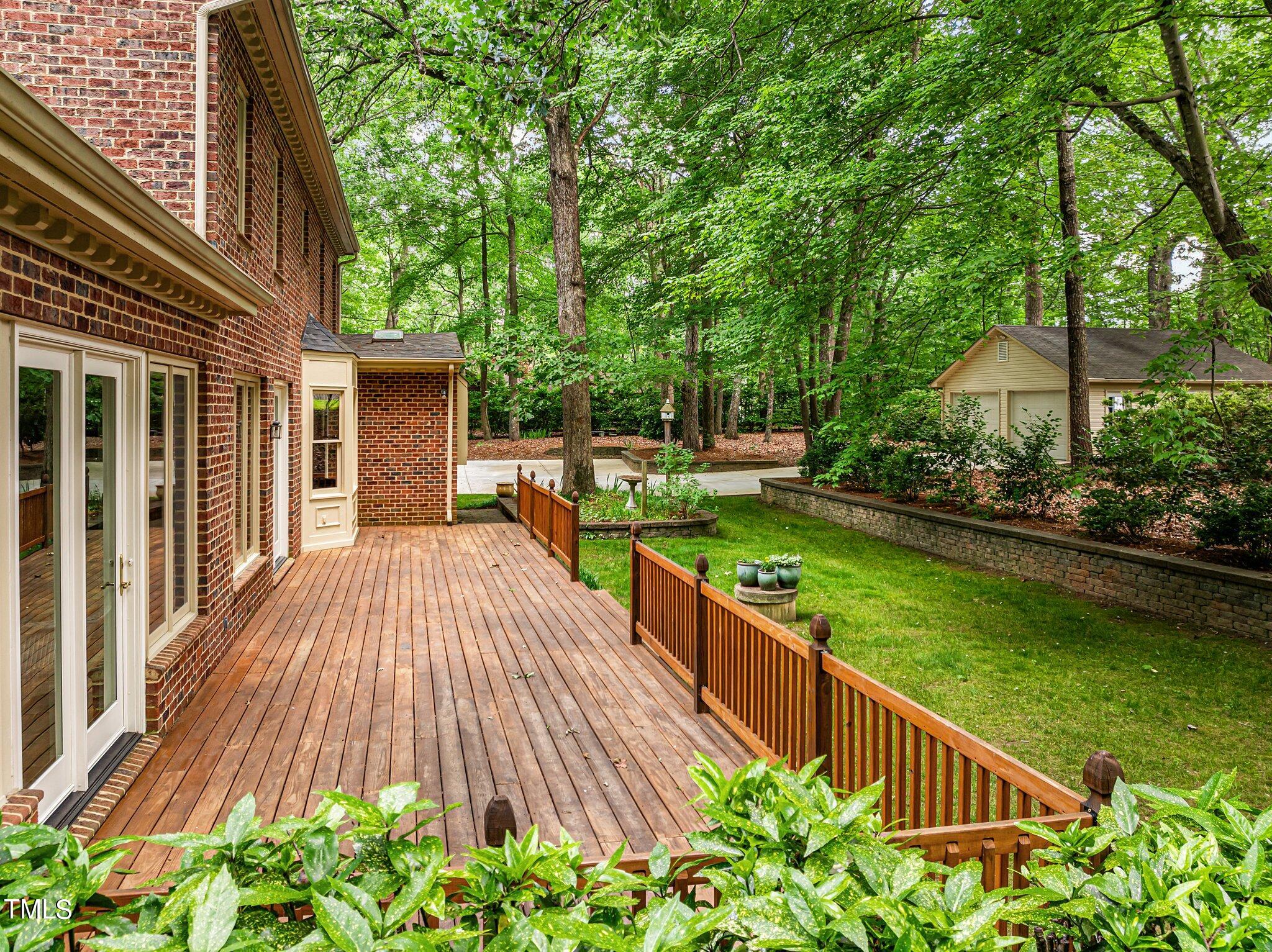 8413 Bournemouth Drive Raleigh, NC 27615 - Photo 82 of 94 a view of a house with backyard and sitting area