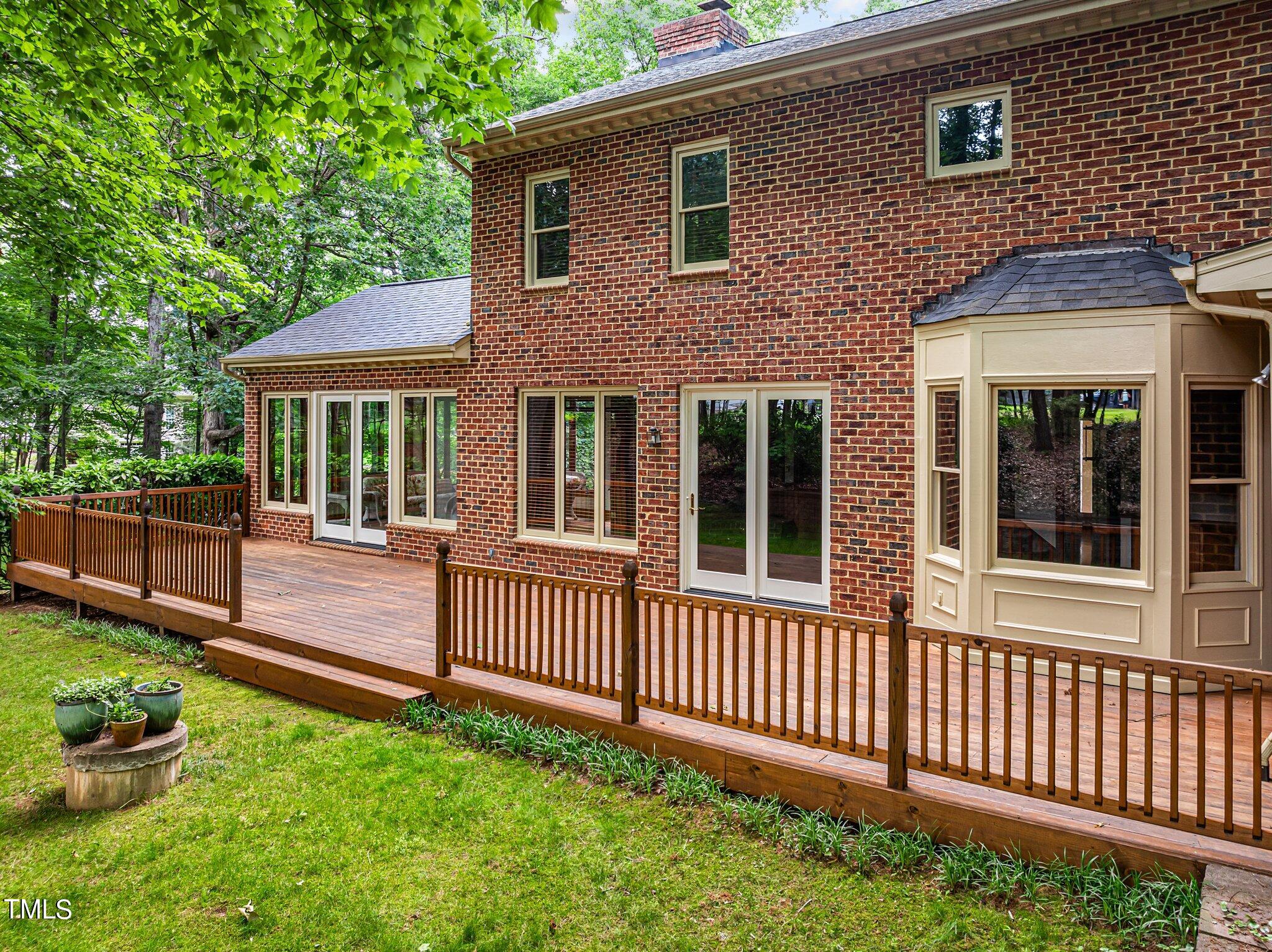 8413 Bournemouth Drive Raleigh, NC 27615 - Photo 83 of 94 a view of a house with a small yard and wooden fence