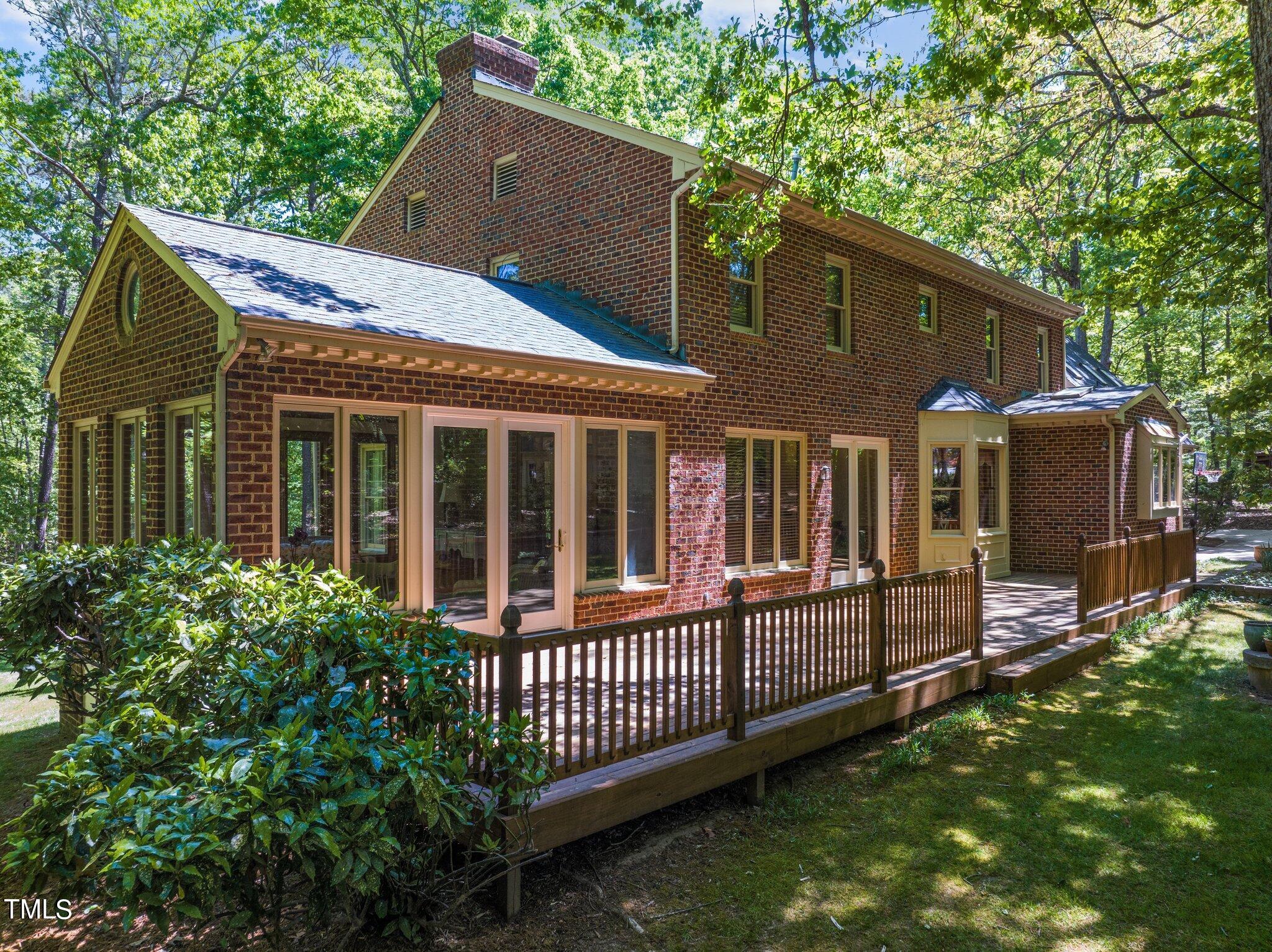 8413 Bournemouth Drive Raleigh, NC 27615 - Photo 85 of 94 a view of a house with a small yard and wooden fence