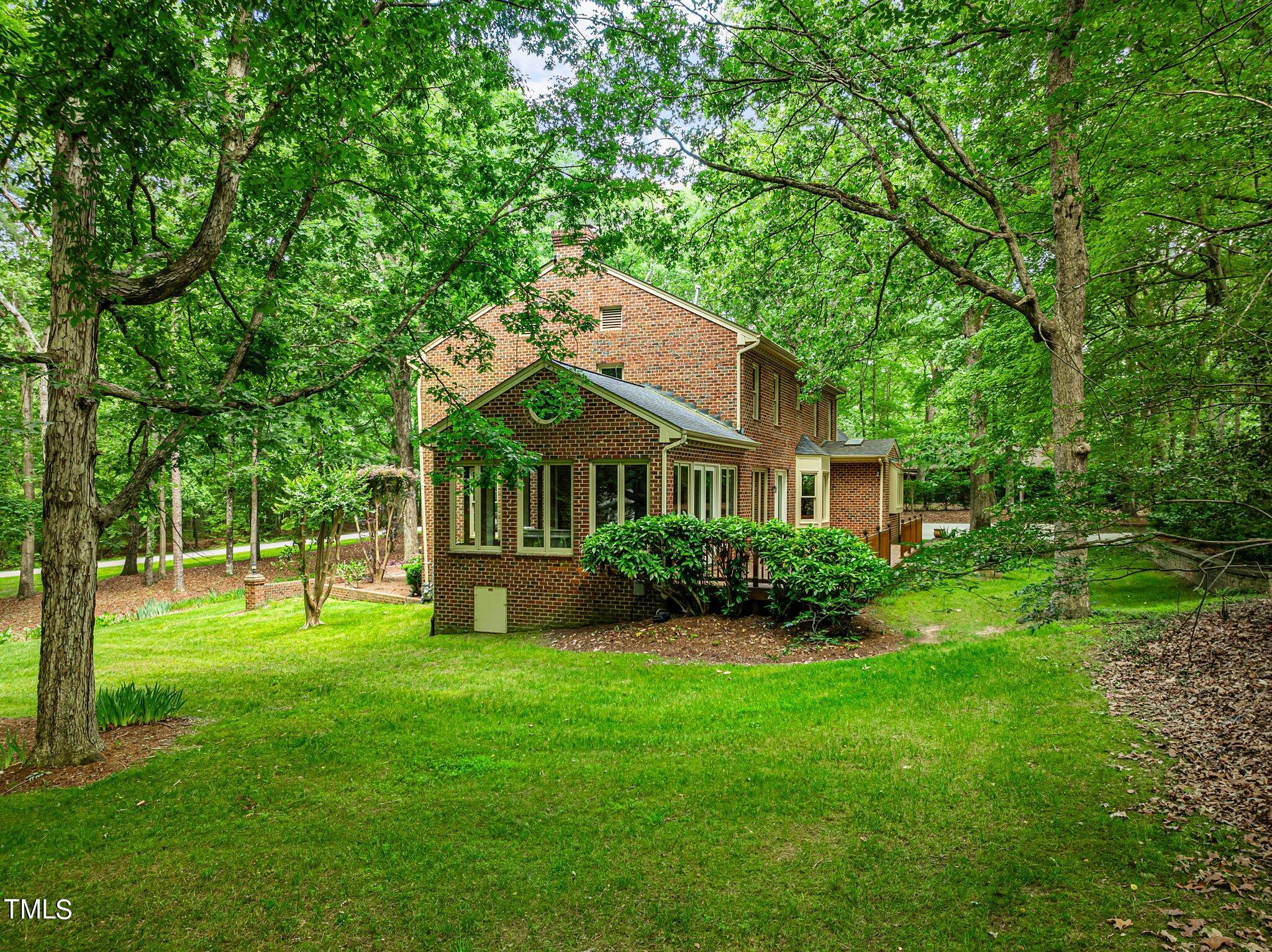 8413 Bournemouth Drive Raleigh, NC 27615 - Photo 87 of 94 a front view of a house with garden
