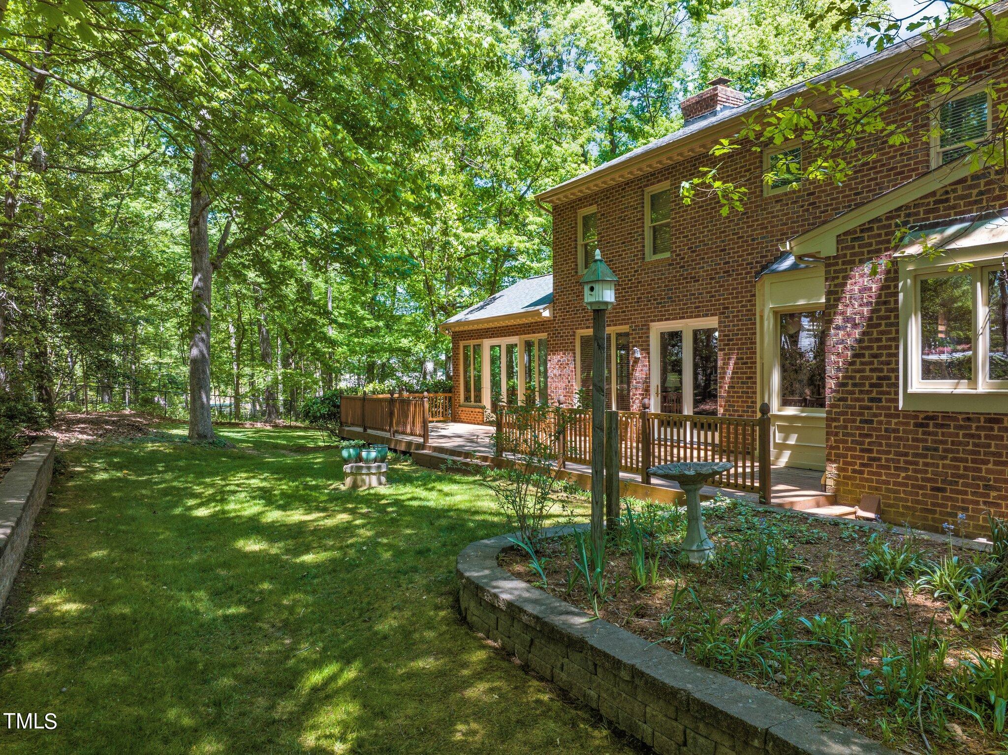 8413 Bournemouth Drive Raleigh, NC 27615 - Photo 89 of 94 a view of a house with backyard and sitting area