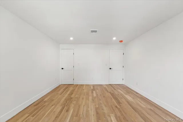 a view of room with wooden floor