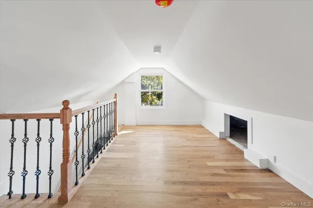 a view of an entryway with wooden floor and windows