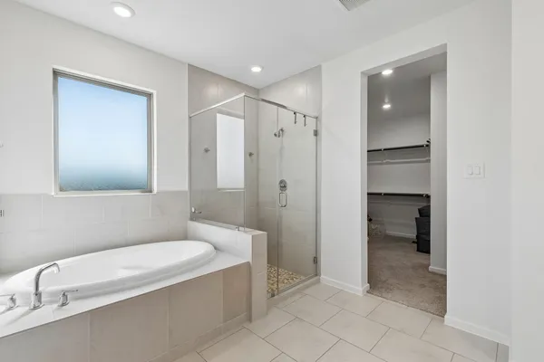 a bathroom with a bathtub and a toilet