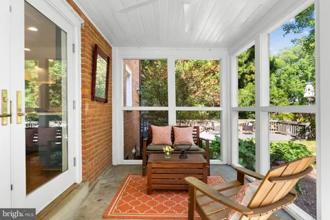 a living room with furniture and windows