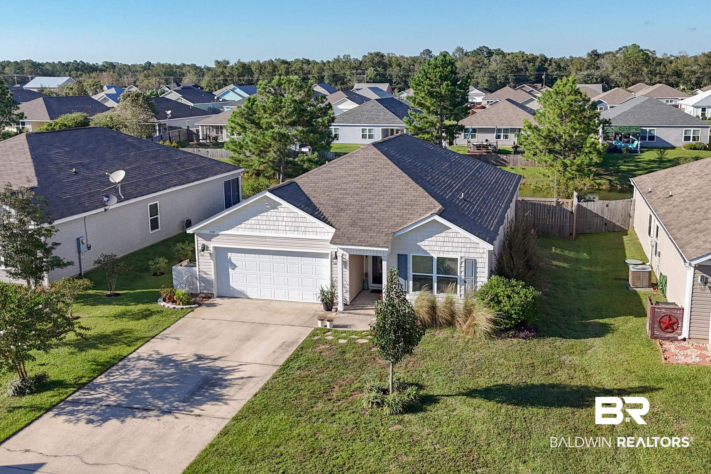 17449 Harding Drive Foley, AL 36535 - Photo 5 of 52 View of front facade featuring a front yard and a garage