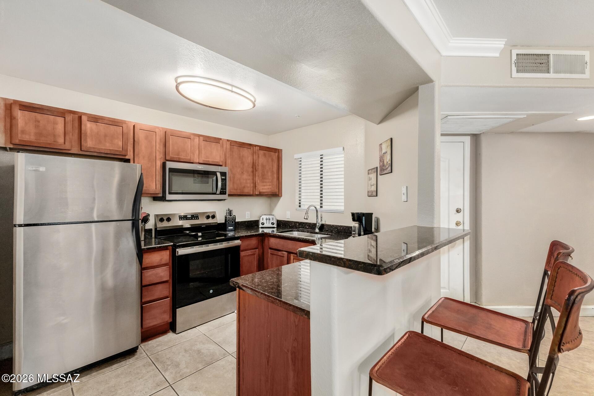 Light and bright kitchen. Laundry room is off of the kitchen area.