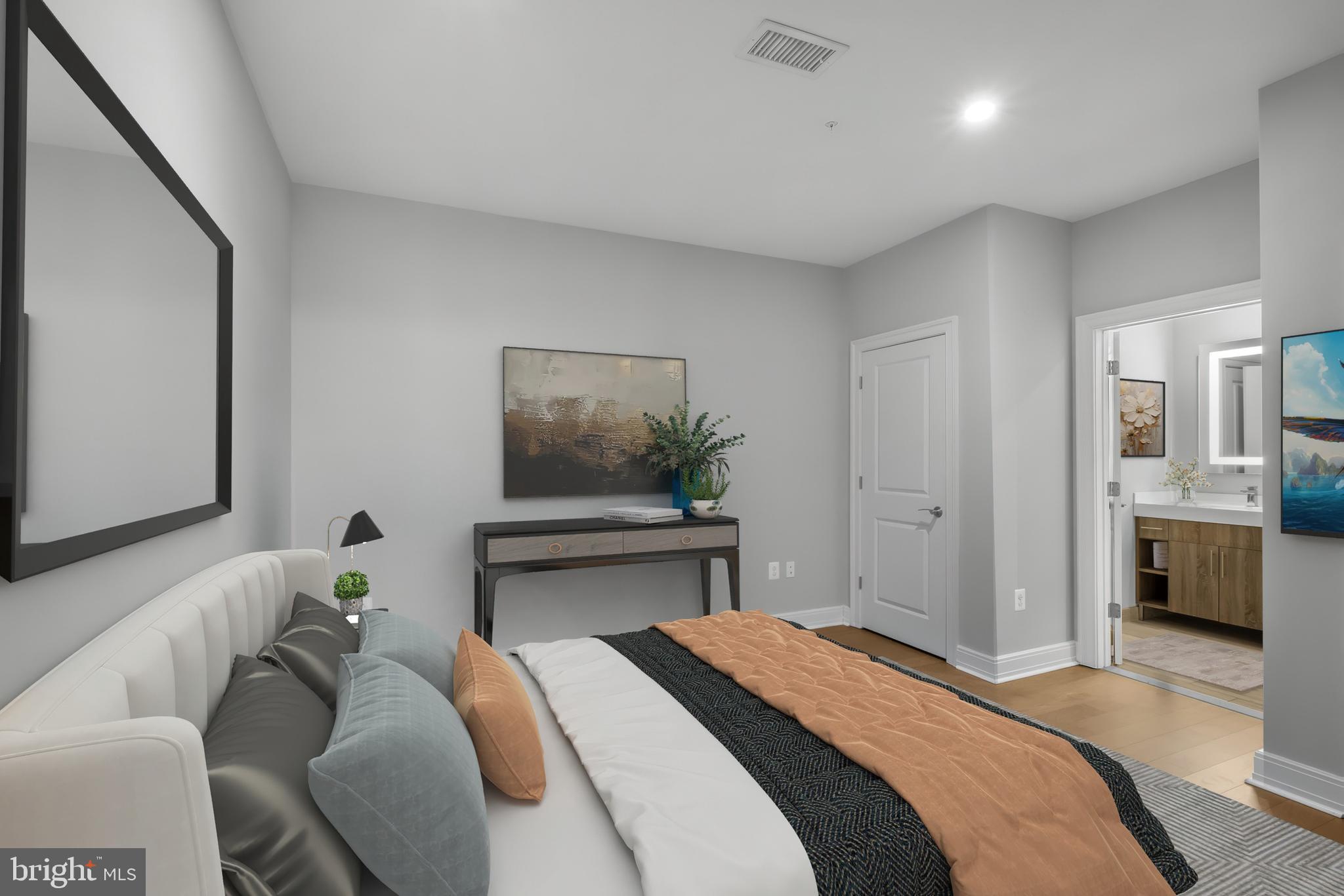 200 North 16th Street, Unit 719 Philadelphia, PA 19102 - Photo 5 of 20 a bedroom with a bed and a chandelier