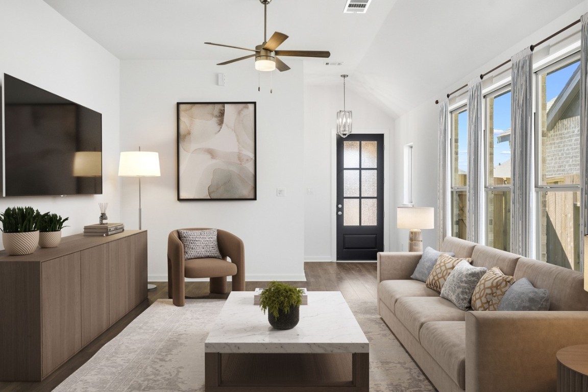 5034 Henry Merritt Street Rosenberg, TX 77471 - Photo 3 of 23 Virtually staged family room looking into the entry. Family room has large windows that bring in tons of natural light.