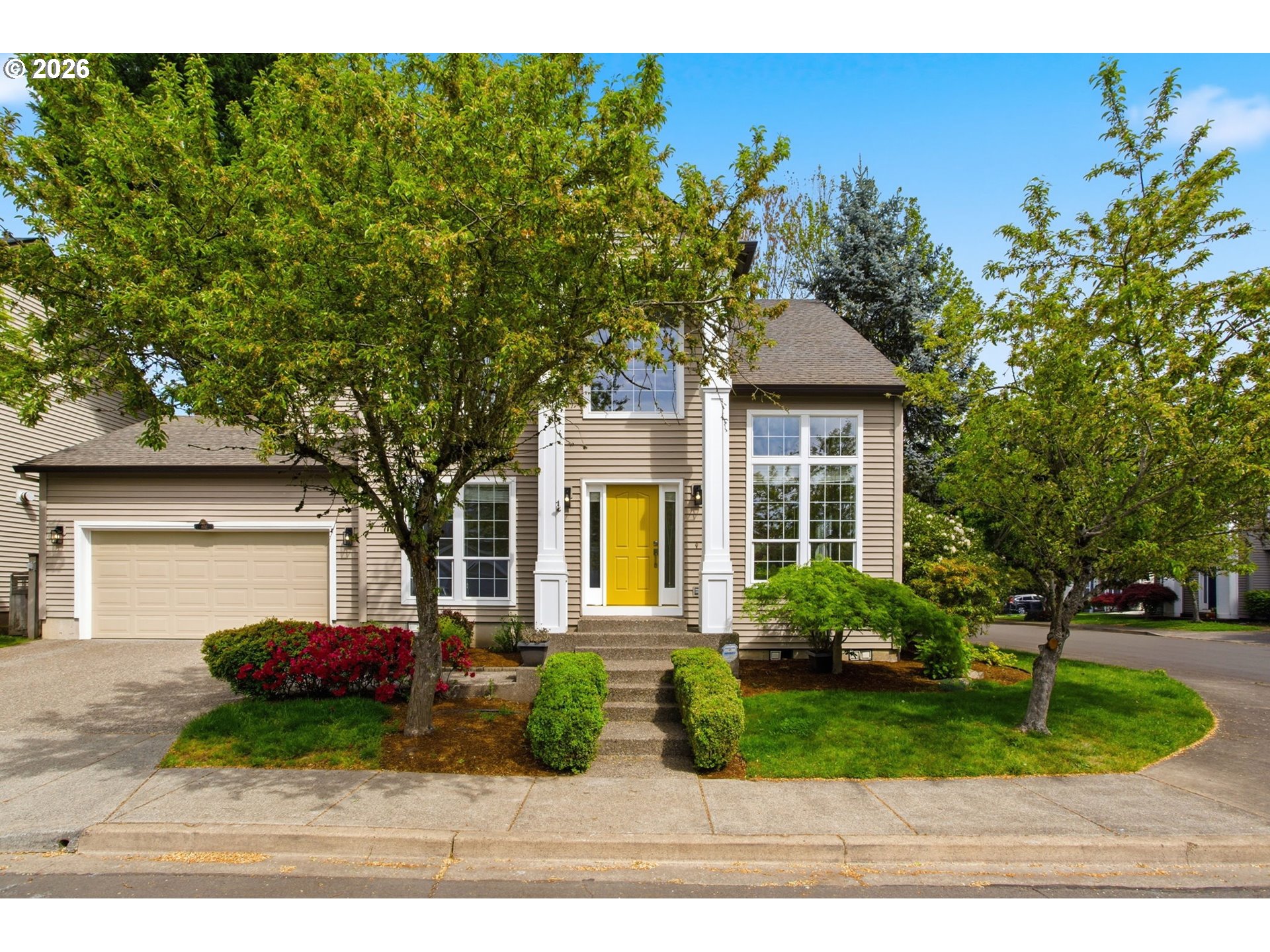 8911 Southwest Gravenstein Lane Tigard, OR 97224 - Photo 2 of 33 a front view of a house with garden