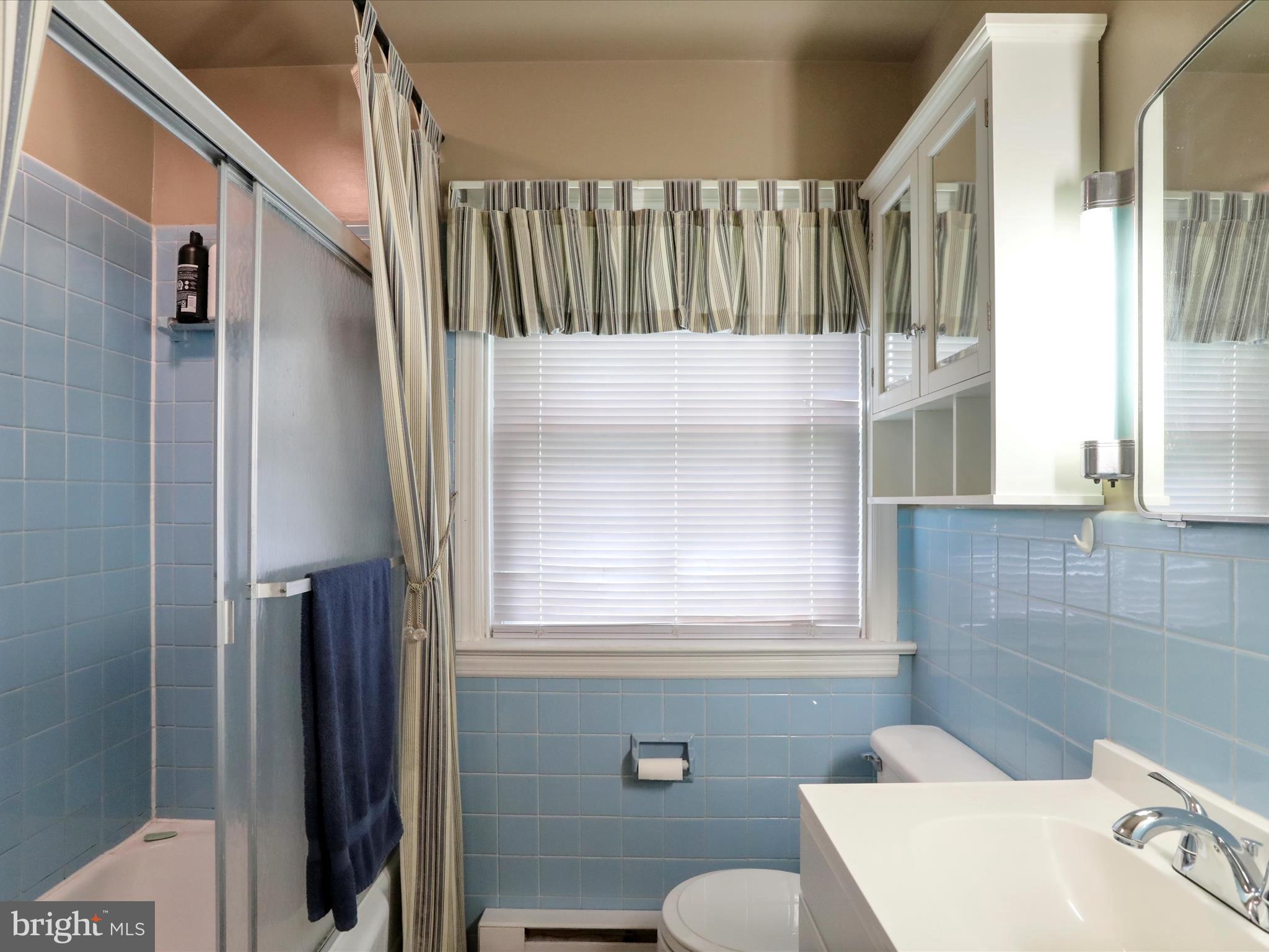 13517 Paradise Church Road Hagerstown, MD 21742 - Photo 11 of 38 a bathroom with a sink toilet and shower
