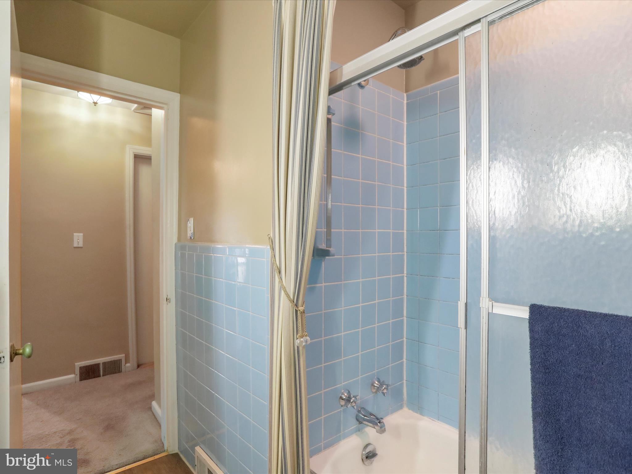 13517 Paradise Church Road Hagerstown, MD 21742 - Photo 12 of 38 a bathroom with a glass shower door