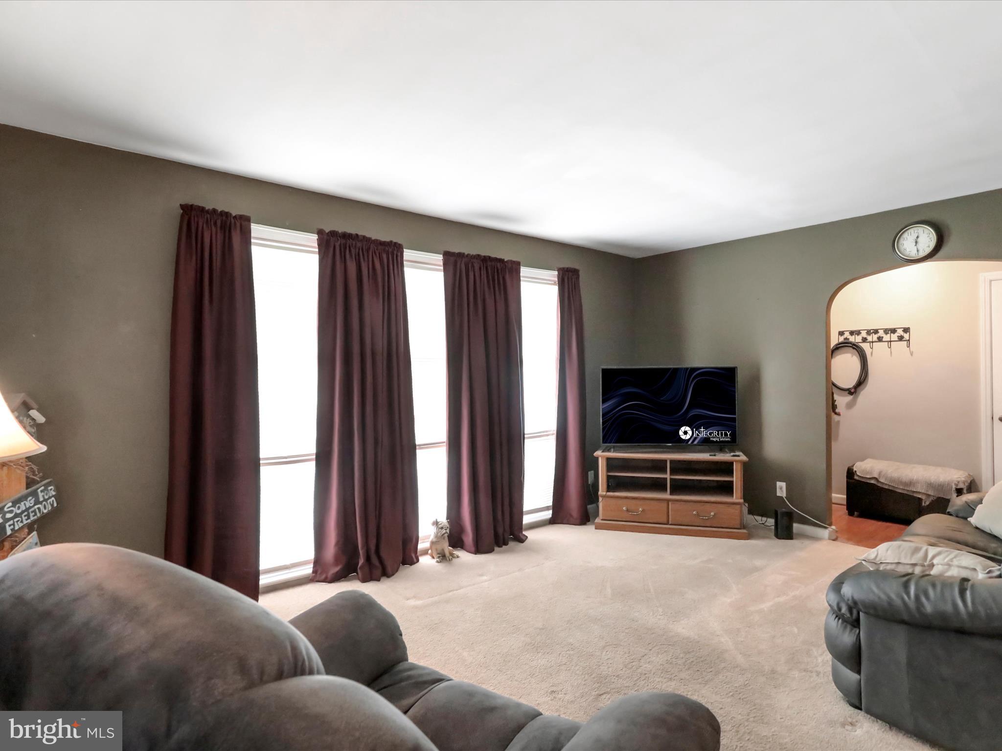 13517 Paradise Church Road Hagerstown, MD 21742 - Photo 15 of 38 a bedroom with furniture and a flat screen tv