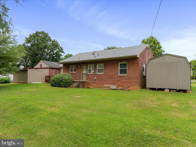 a view of a house with a door and wooden floor