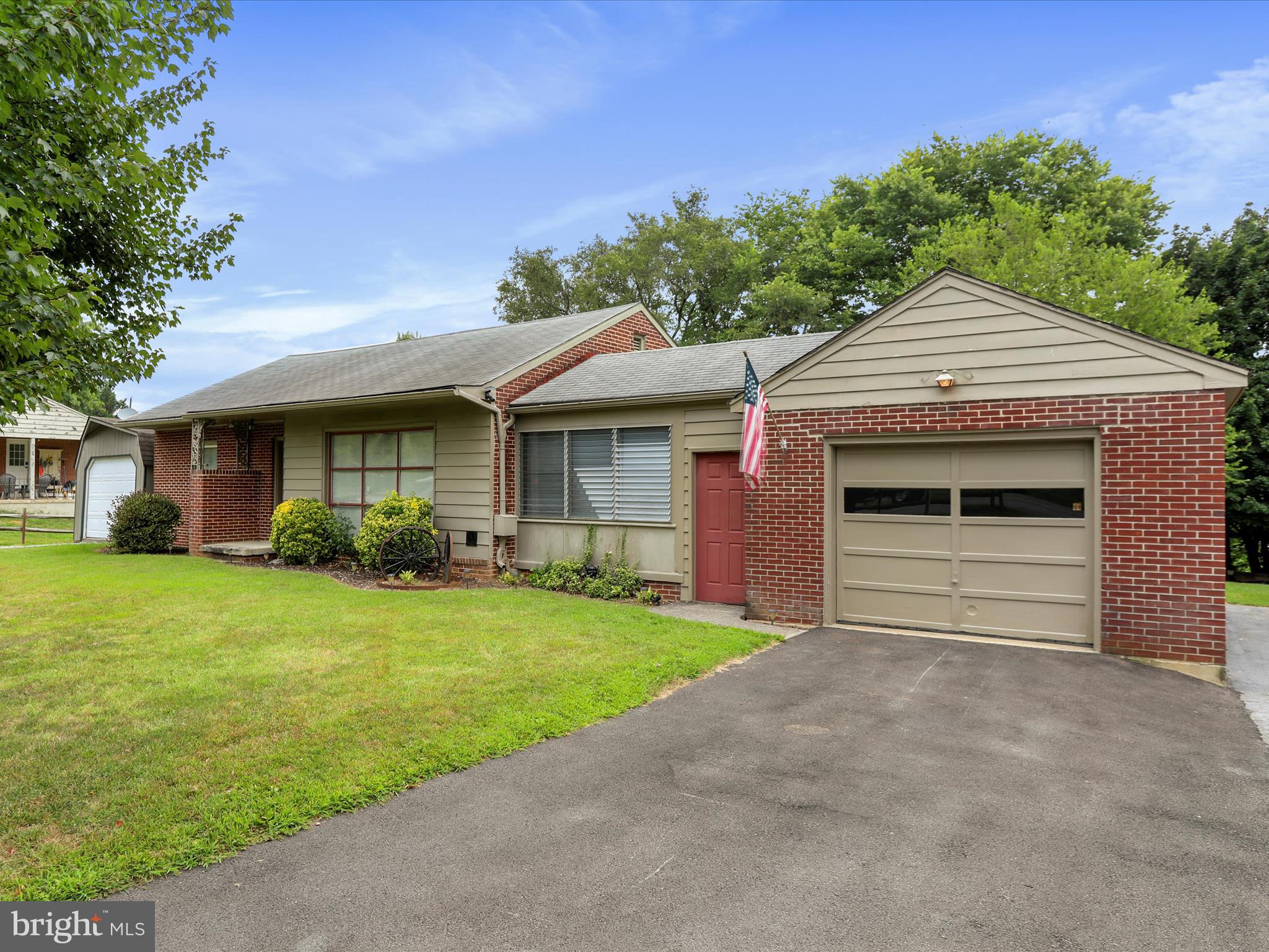13517 Paradise Church Road Hagerstown, MD 21742 - Photo 5 of 38 a front view of a house with a garden