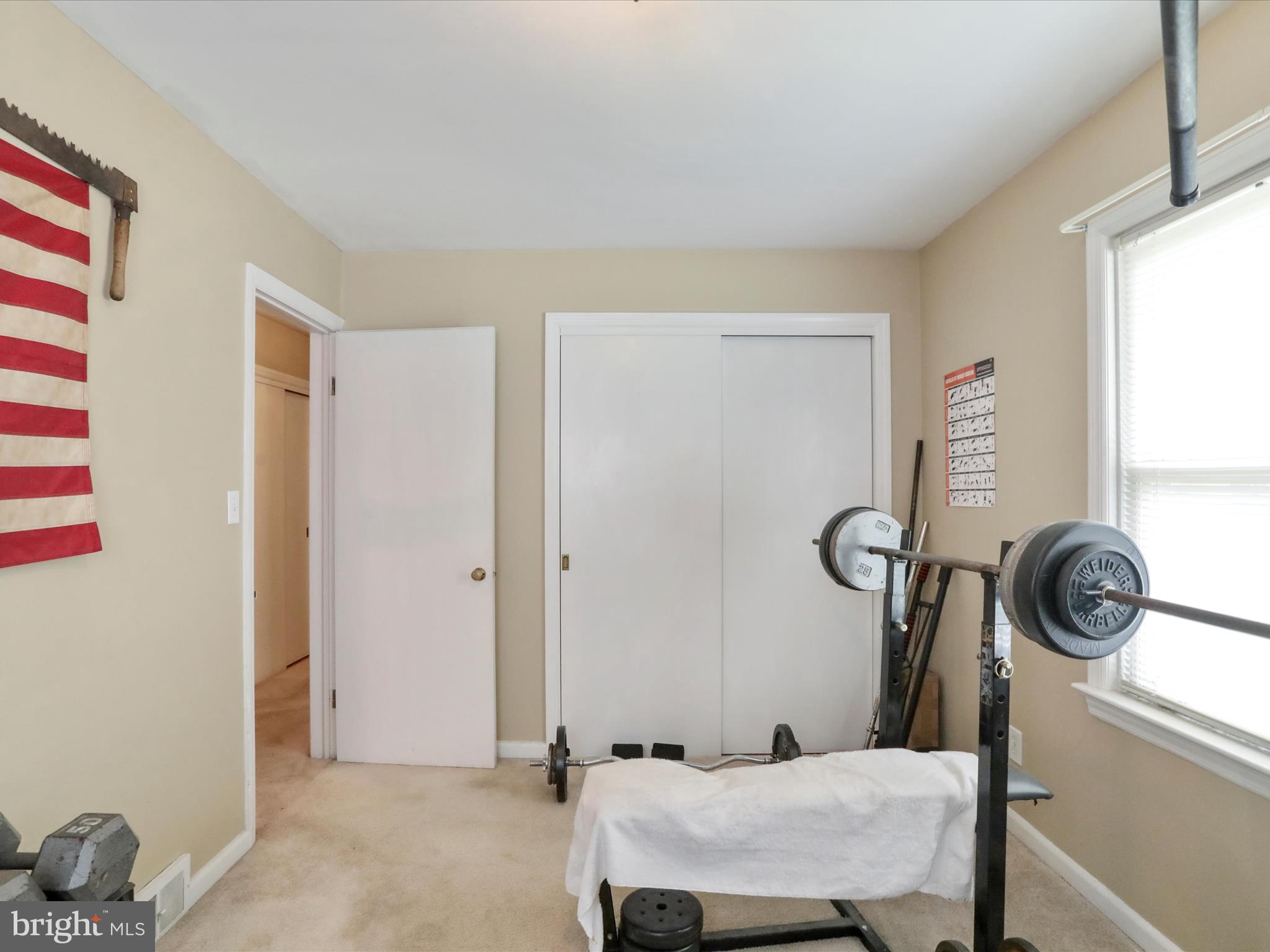 13517 Paradise Church Road Hagerstown, MD 21742 - Photo 7 of 38 a bathroom with a sink a mirror and a window