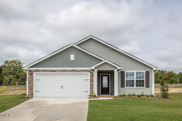 64 Rider Street Broadway, NC 27505 - Photo 1 of 11 front view of house with a yard