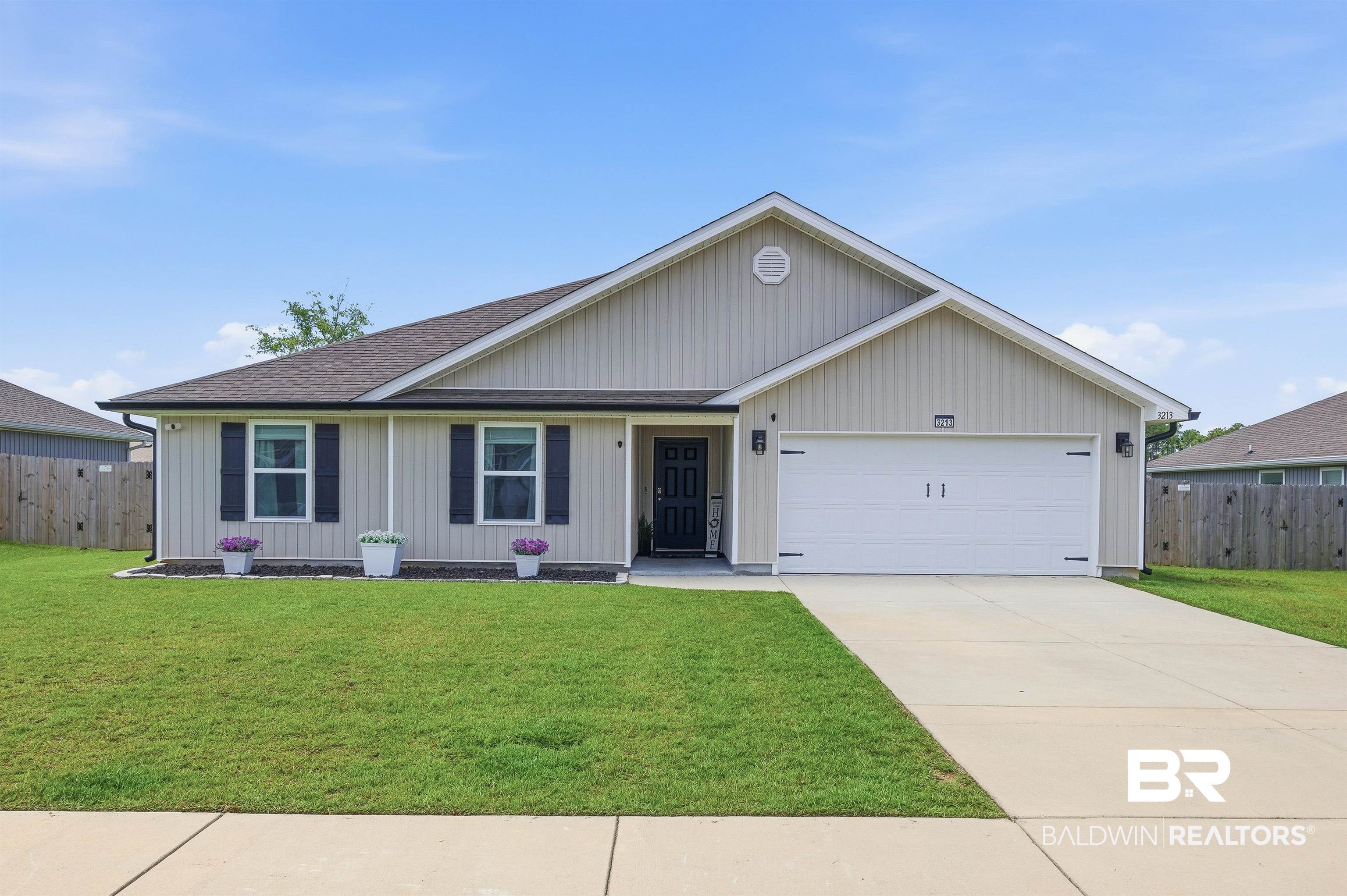 3213 Camino Real Loop Lillian, AL 36549 - Photo 1 of 61 Single-story residence featuring light neutral siding and dark shutters