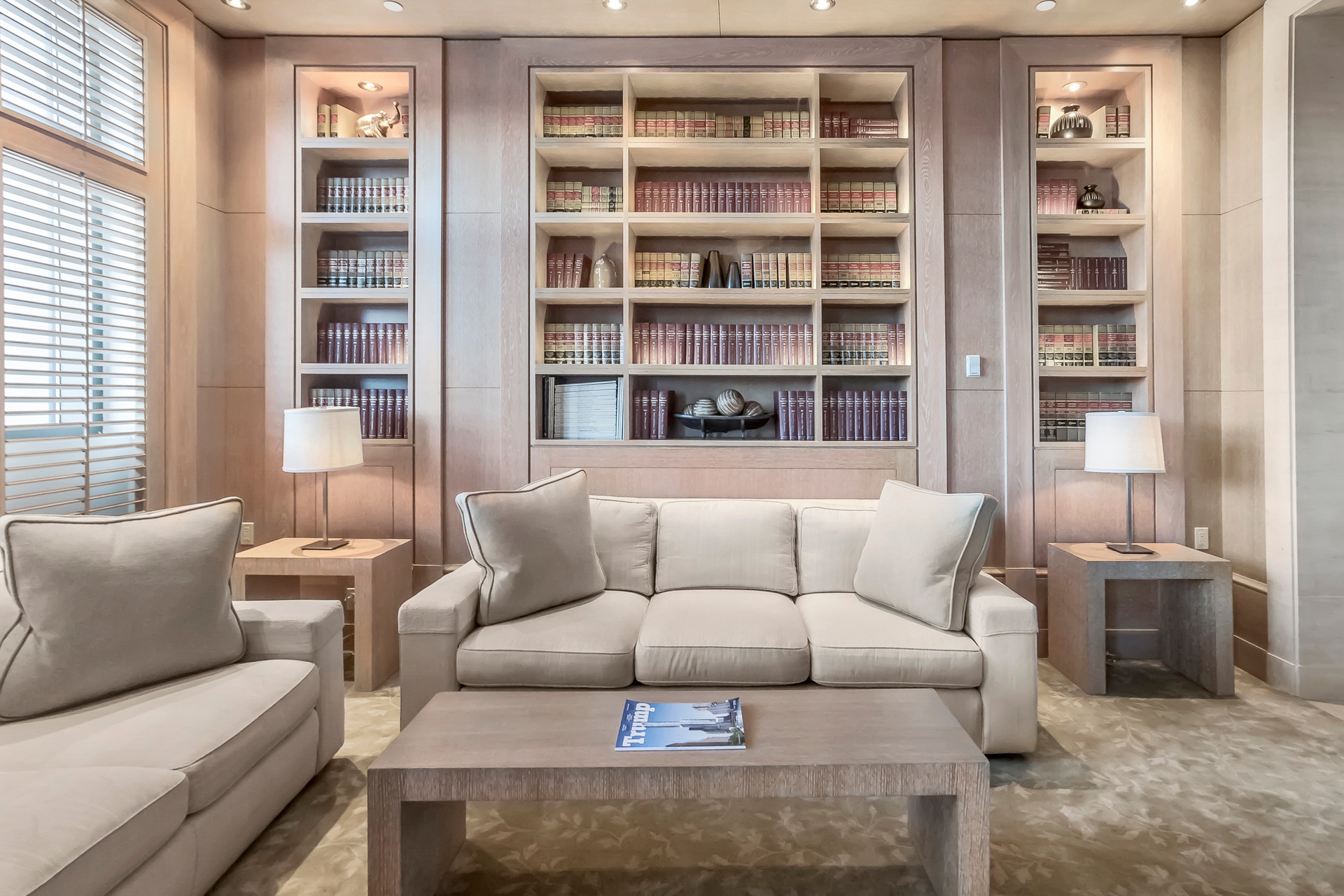 240 Riverside Boulevard, Unit SUITE1 Manhattan, NY 10069 - Photo 27 of 33 a living room with furniture and a book shelf