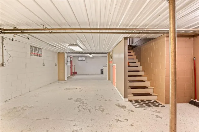 a room with a bed and a window