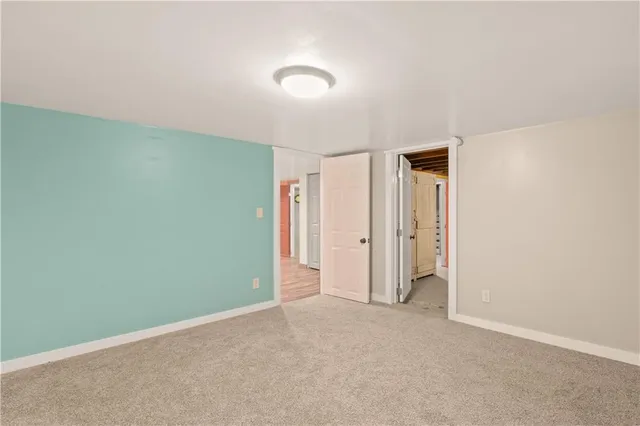 a white toilet sitting next to a white sink