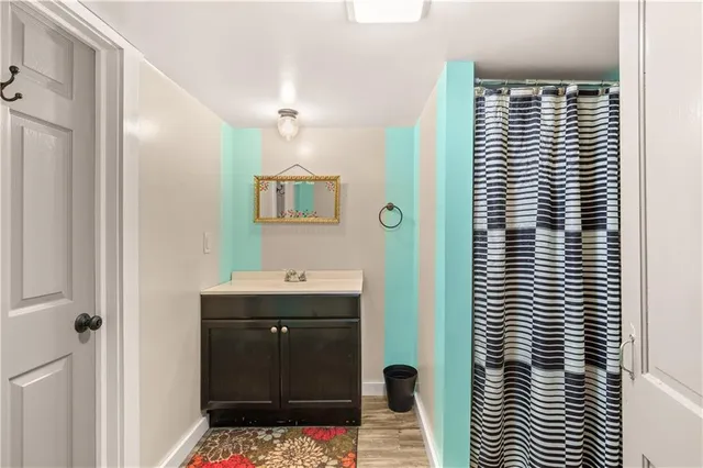 a view of a room with wooden walls