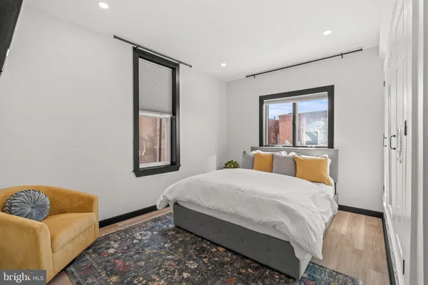a bedroom with a bed and couch