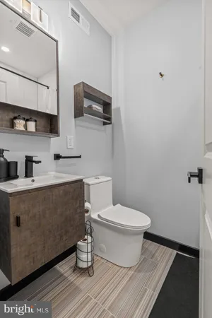a bathroom with a toilet and a sink