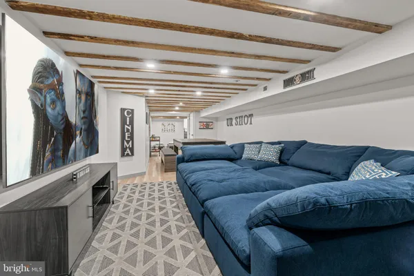 a living room with furniture and a rug