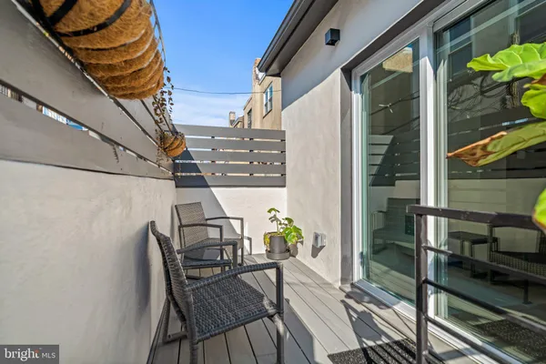 a view of balcony with furniture