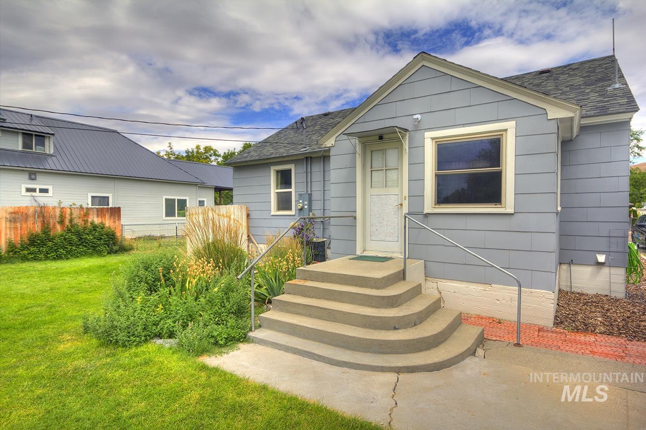 351 West Main Street South Vale, OR 97918 - Photo 24 of 33 Light blue siding exterior with a contrasting dark shingle roof