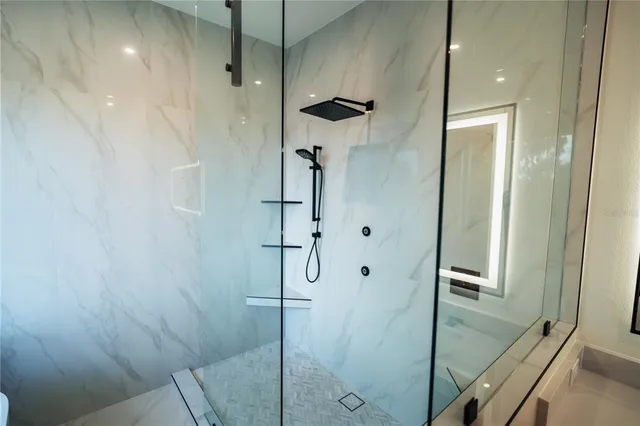a large bathroom with a double vanity sink and mirror