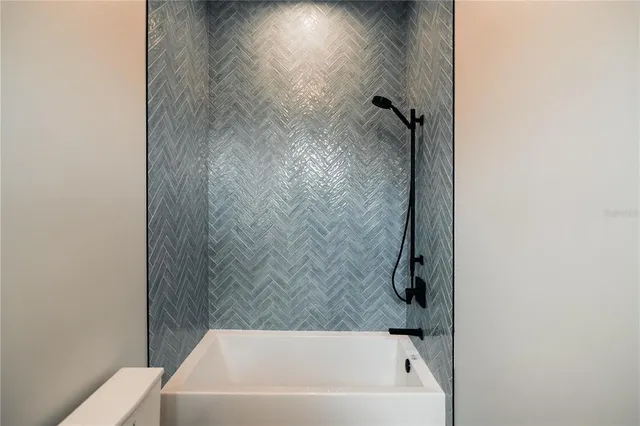 a bathroom with a shower and a toilet