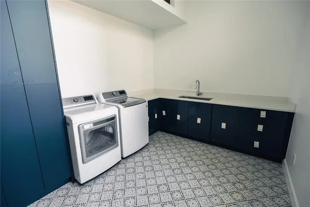 an empty room with wooden floor and large window