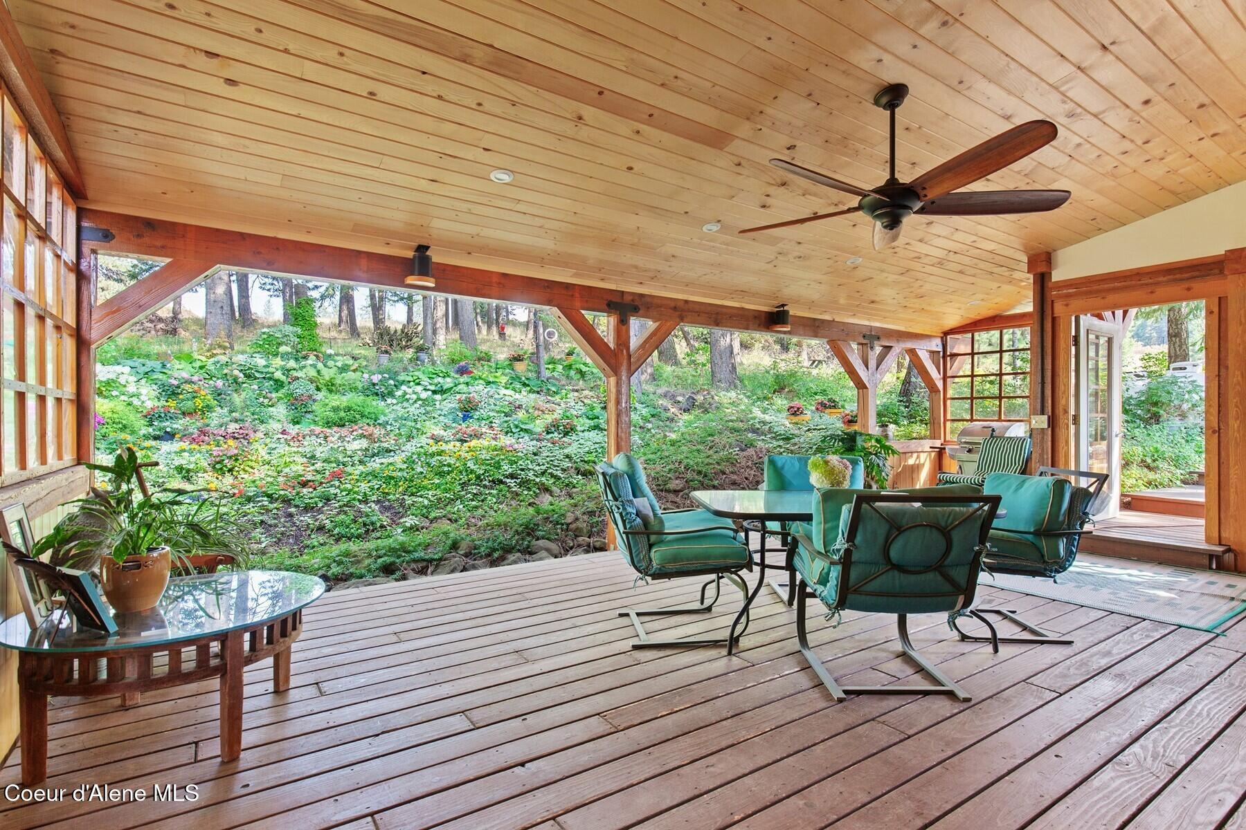 8562 South Gozzer Road Harrison, ID 83833 - Photo 12 of 40 Back Deck with lush garden