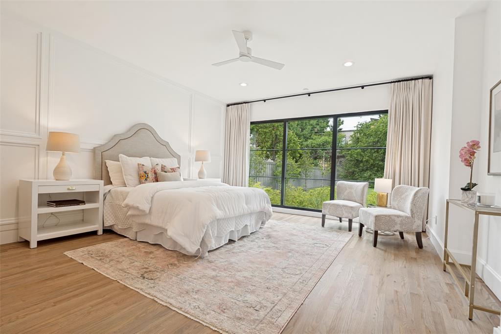 4325 Pomona Road Dallas, TX 75209 - Photo 14 of 23 Spacious room featuring wood-finish flooring, a contemporary ceiling fan, recessed lighting, and large windows with black framing