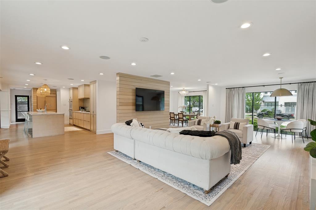 4325 Pomona Road Dallas, TX 75209 - Photo 4 of 23 Open concept living area with light wood-finish flooring
