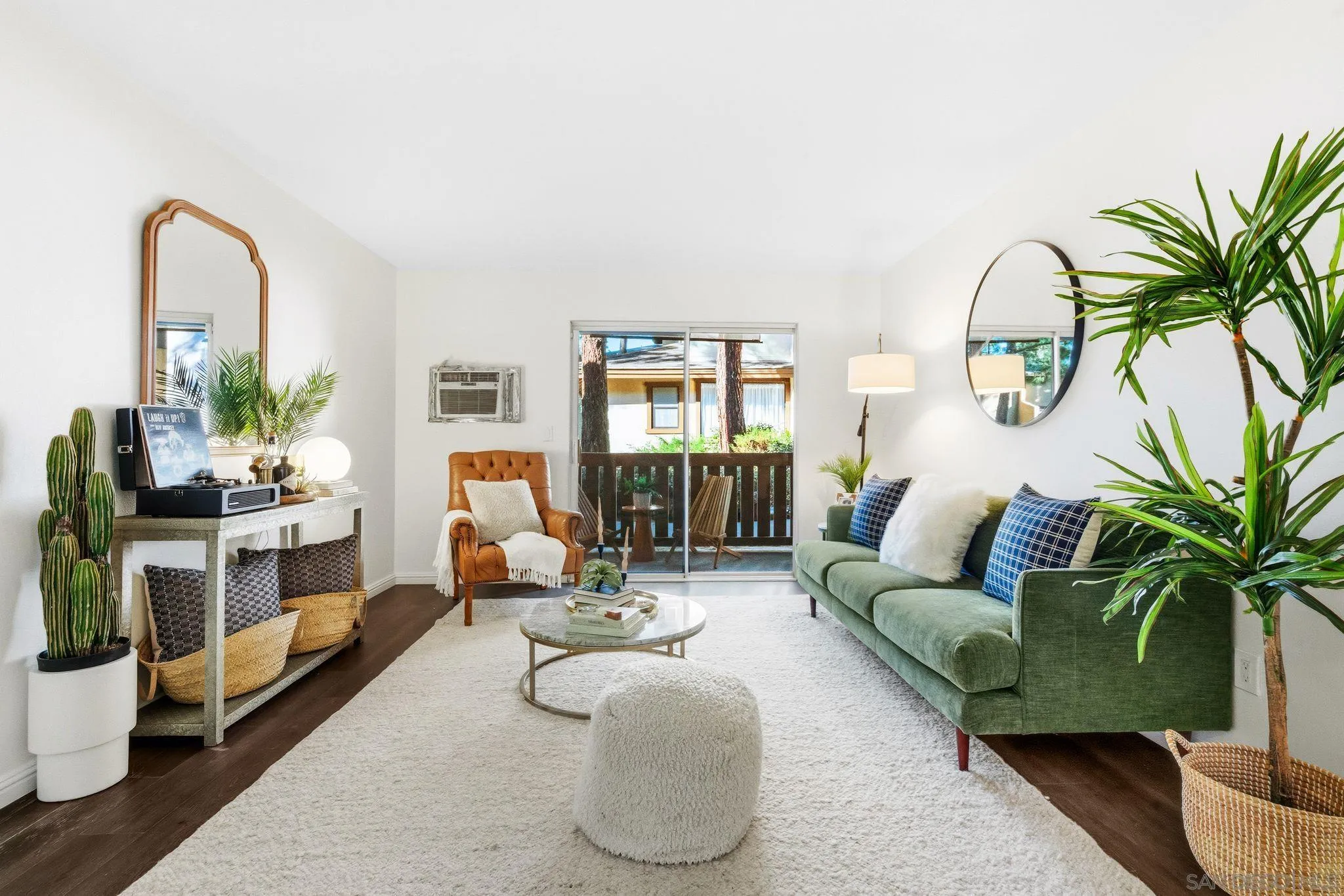 10226 Black Mountain Road, Unit 83 San Diego, CA 92126 - Photo 1 of 23 a living room with furniture flowerpot and a potted plant