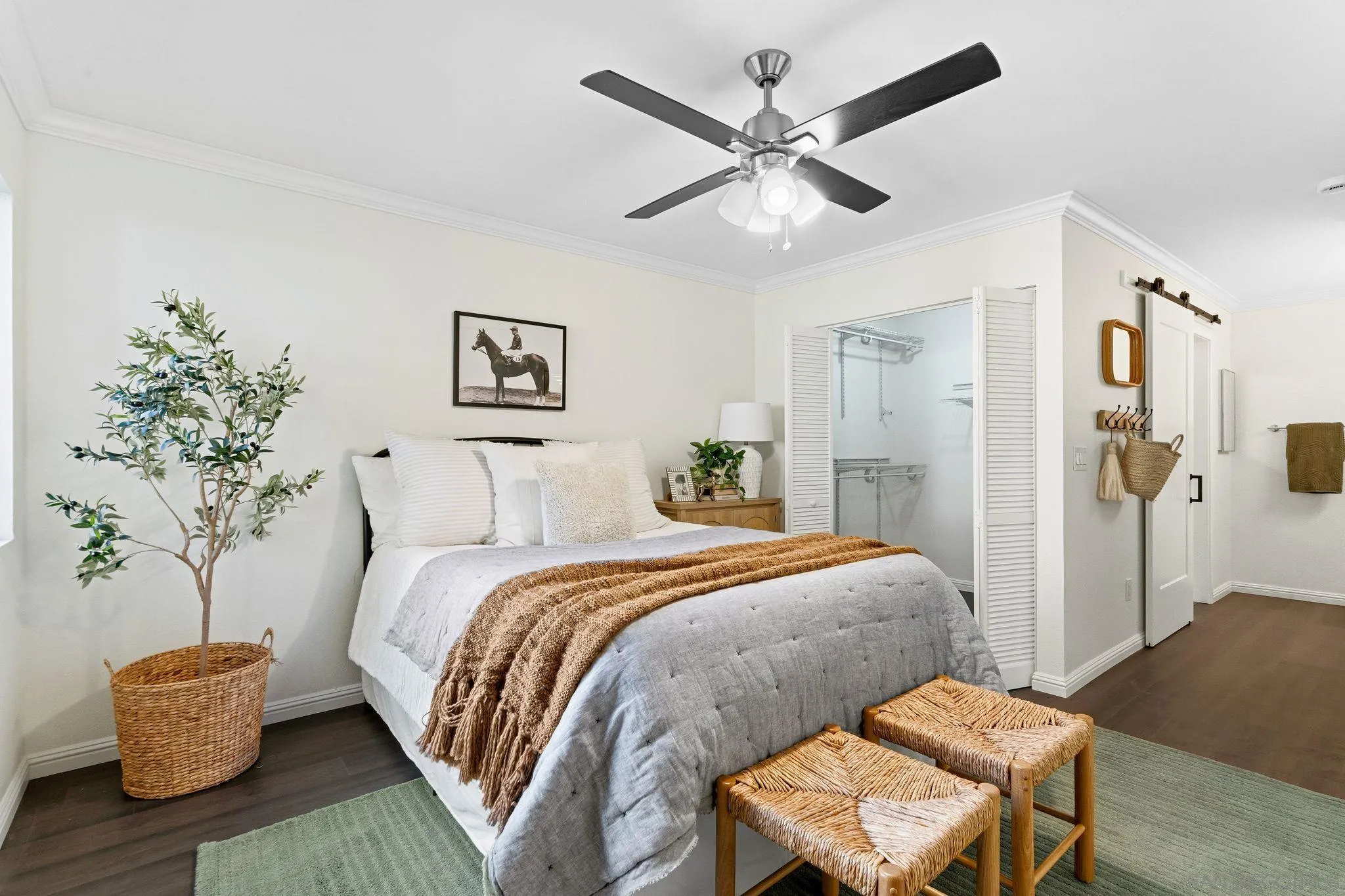 10226 Black Mountain Road, Unit 83 San Diego, CA 92126 - Photo 11 of 23 a bedroom with a bed and a chandelier