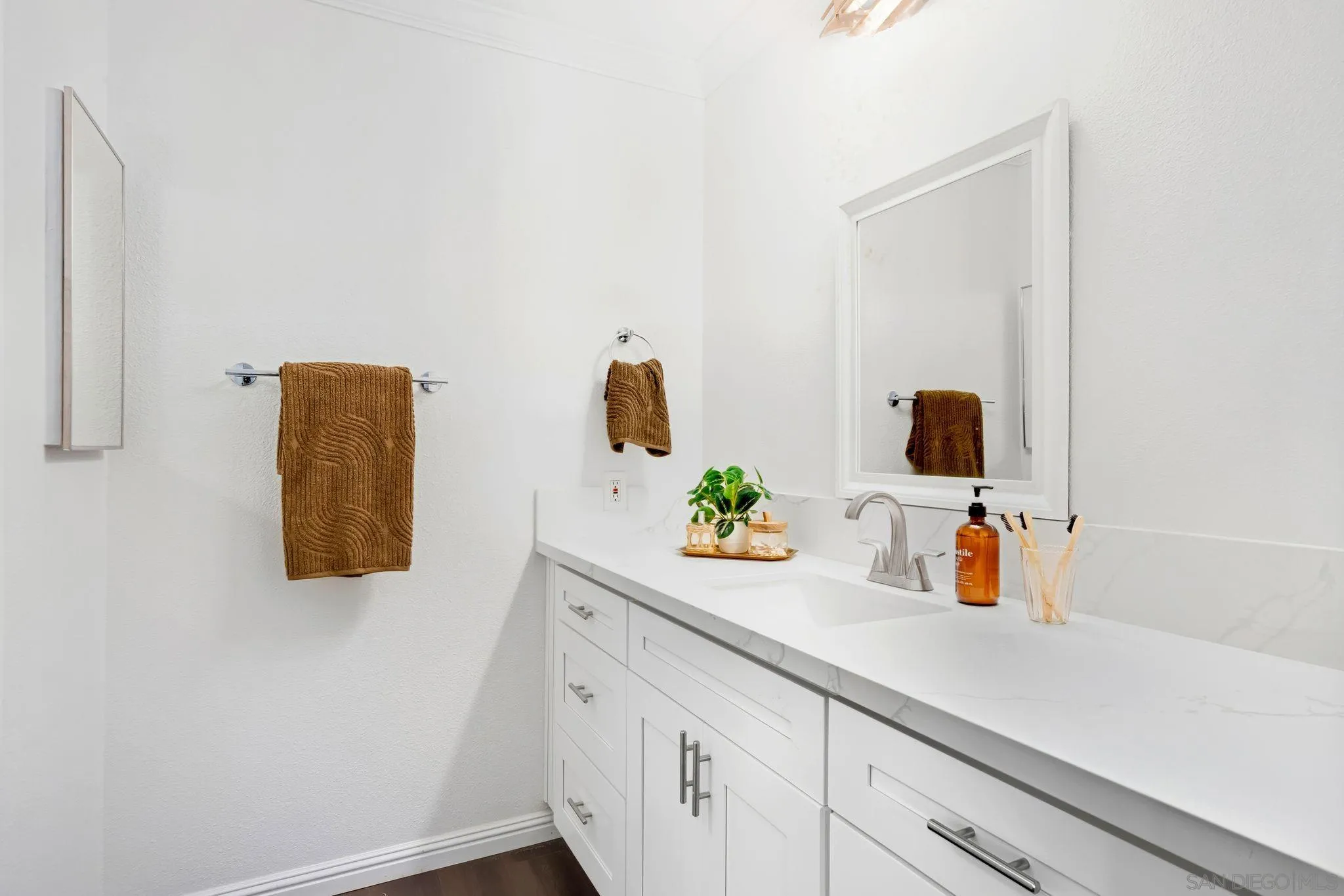 10226 Black Mountain Road, Unit 83 San Diego, CA 92126 - Photo 14 of 23 a bathroom with a sink and a mirror